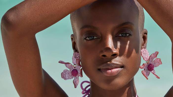 Madisin Rian was photographed by James Macari in the Dominican Republic. Earrings by Lele Sadoughi.